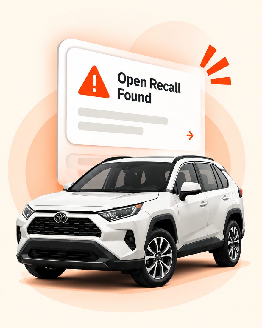 White SUV with an 'Open Recall Found' notification